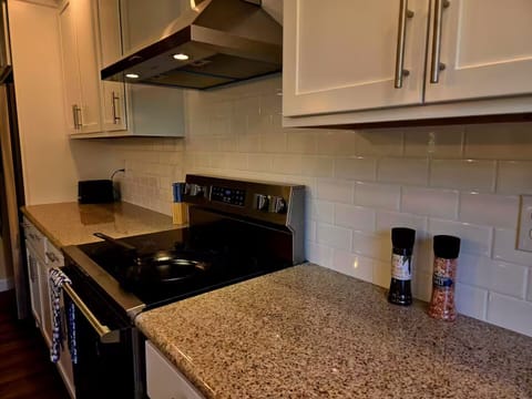 Granite counters with tile backsplash