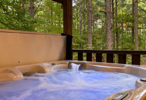 Relax in your private bubbling hot tub surrounded by forest serenity