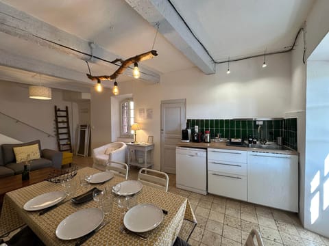dining area, kitchen, table, living room, sofa, kettle, coffee machine, toaster
