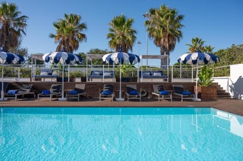 Lounge in shaded comfort steps from the refreshing water.