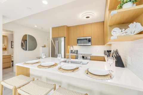 Gather around the island with food and wine