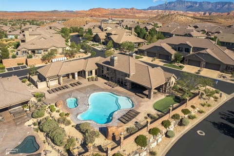 Aerial view of Canyon Villas pool area with desert backdrops and scenic red rock views.