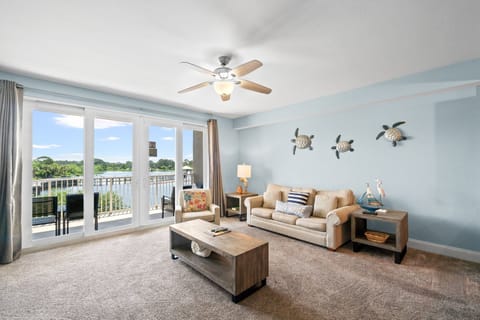 Slide open the doors to your private balcony, where tranquil views of the property's lake offer the perfect backdrop for morning coffee or sunset cocktails.