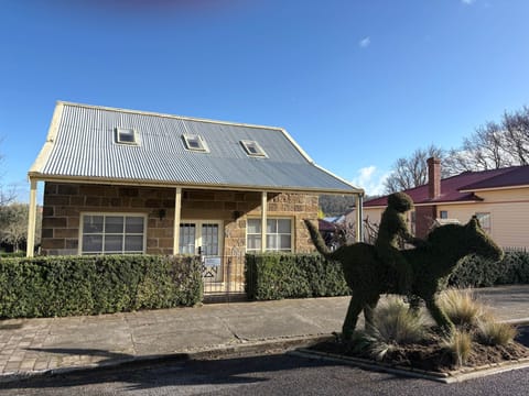 Heritage charm meets modern comfort in this beautifully renovated brick and sandstone cottage.