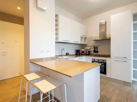 Kitchen, Countertop, Kitchen Appliance, Interior Design, Flooring, Cabinetry, Floor, Furniture, Major Appliance, Wood