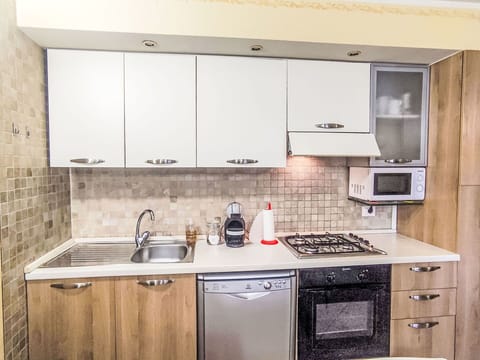 Kitchen Appliance, Kitchen, Cabinetry, Countertop, Major Appliance, Furniture, Wood, Home Appliance, Interior Design, Kitchen Stove