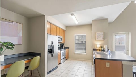 Fully stocked kitchen with dishwasher and laptop-friendly workspace