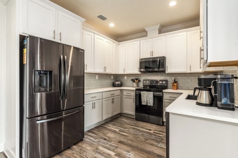 Coastal Château Modern Kitchen with Stainless Appliances