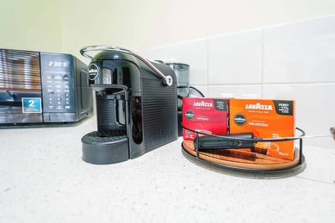 Start your day with a Lavazza espresso from the fully equipped kitchen, complete with complimentary pods and garden views.