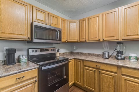 Prepare delicious home-cooked meals in this fully stocked, modern kitchen.