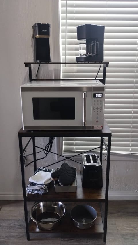 Keurig style and traditional coffee machines. Large microwave. Dog bowls.