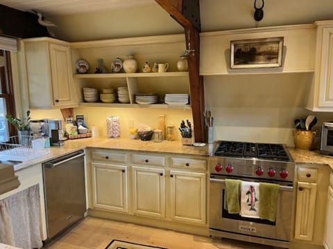 Charming kitchen with high-end appliances: wolf stove, cove dishwasher