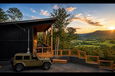 Modern mountain retreat with sunset views and a scenic private deck