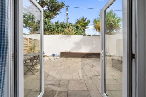 Patio Doors Lead to Patio at Macalby Cottage, Harlyn Bay,  Holiday Home