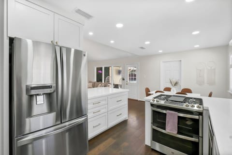 Fully equipped modern kitchen with stainless steel appliances