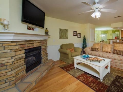 Relax by the stone fireplace after a day exploring.
