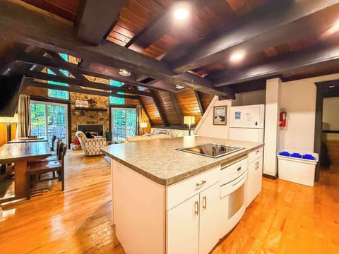 The full kitchen, dining room and living room.