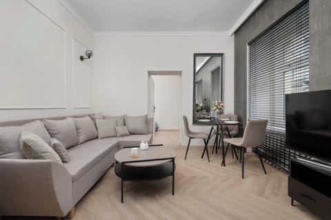 Relax in the stylish living room with a comfortable sofa and modern decor.