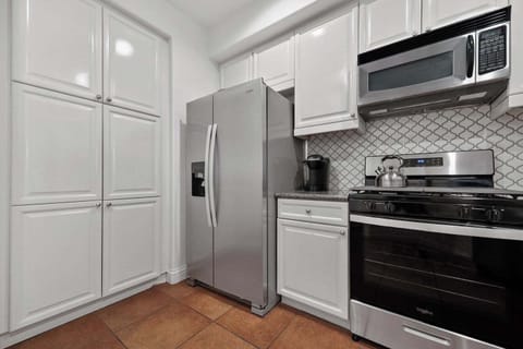 Full-size Refrigerator/Freezer with ice and filtered water dispenser.