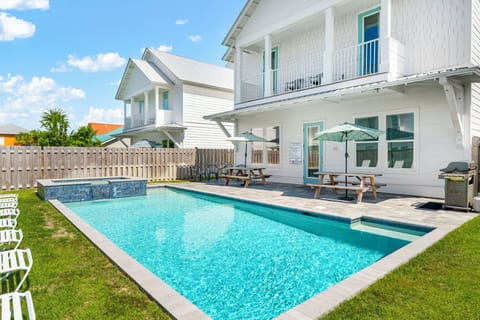 The spacious pool area at Ellis Sands has loungers and shade
