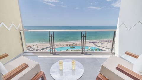 Step out onto a private balcony and take in serene ocean views, ideal for morning coffee or relaxing at sunset