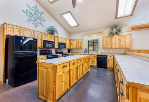 Multiple stoves and prep areas ensure there’s plenty of room for cooking together during events or large gatherings.