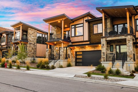 Experience modern mountain living at its finest. This stunning architectural gem welcomes you home under a vibrant Park City sky.