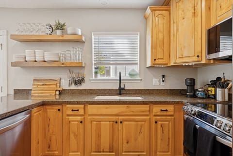 Sparkling Clean updated kitchen with solid surface countertops, hardwood floors, new LG stainless appliances, induction range, ice maker, microwave, dishwasher.  Nespresso, French press & drip coffee.  Hosts provide starter Nespresso pods and a selection of coffee grounds and supplies