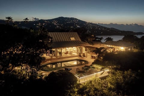 Unwind in the evening by the pool, surrounded by the lush tropical gardens this property offers. You can see Magens Bay in the back, only couple minutes drive.