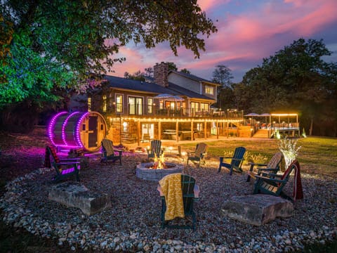 Enjoy the firepit (seating for 12) and sauna adjacent to the walk out basement where the poker room and lounge are located