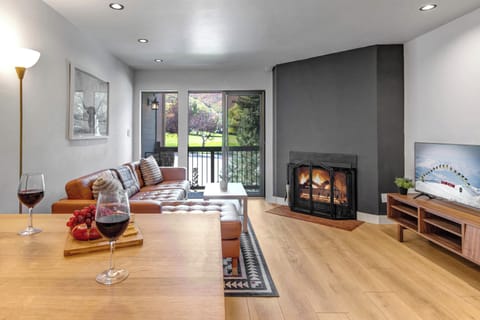 Snowcrest 216 has an inviting living room with wood burning fireplace and new furnishings.