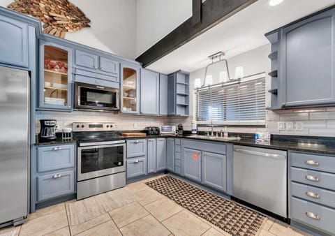 Spacious kitchen with modern appliances and cozy charm