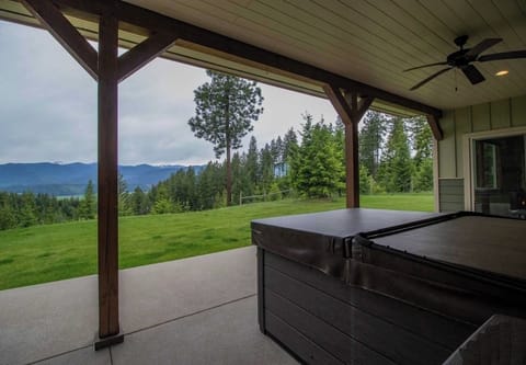 Hot Tub on back patio with view of Valley below and Mountains across the valley