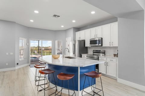 Kitchen w/ bar seating for 6