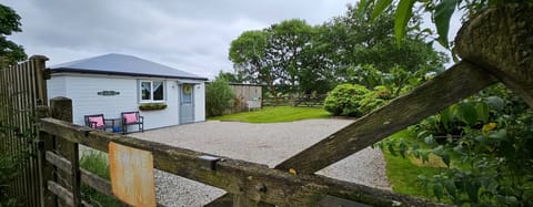 The entrance gate to The Signal Box showing front driveway with ample parking area