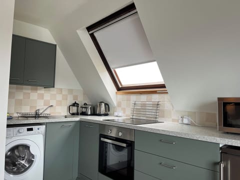 Kitchen area | Schiehallion - Kylesku Lodges, Kylesku, near Lairg