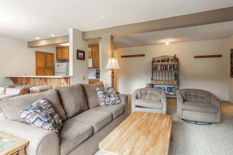 Cozy living room w/ smart TV, fireplace, sofa bed, & balcony access