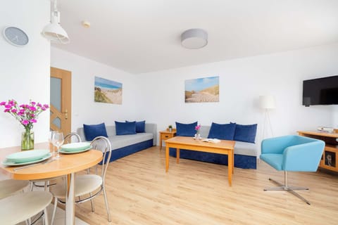 Relax in the stylish living room with two comfortable sofas and modern decor.