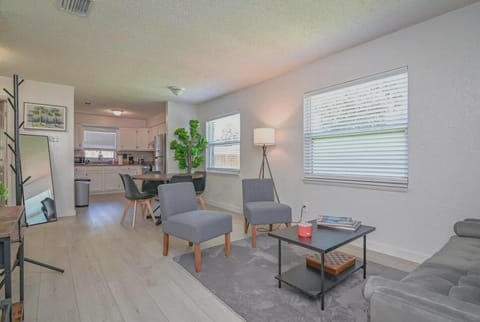 Enjoy a spacious living area designed for remote work, with comfortable seating and a clear view of the home’s heart.
