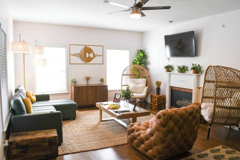 “Bright living area with smart TV and space for everyone to relax.”
