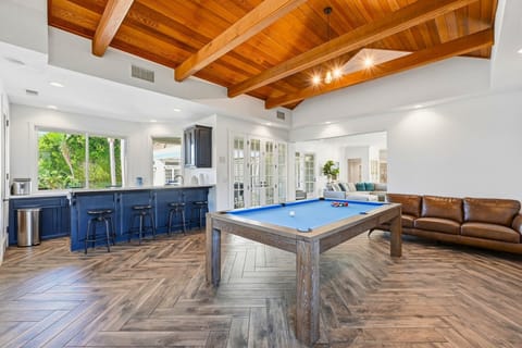 Game Room with vaulted wood ceiling