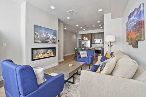 Cozy living room with cushy couch and vibrate TV