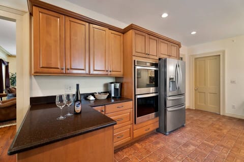 A warm and inviting kitchen stocked with everything you need. Spacious counters, plenty of storage, double-wall ovens for family meals, a Keurig for your morning coffee, and a large fridge ready for all your favorites.