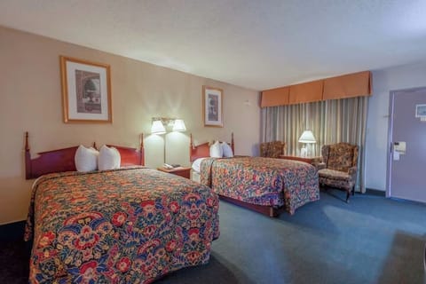 Settle in after arrival with two cozy beds and seating.