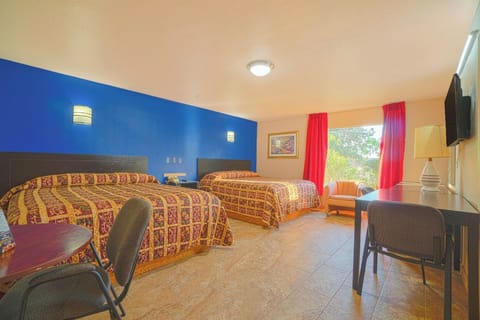 Stretch out with two beds, a desk, and sunny window views.