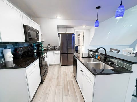 Granite countertops and stainless steel appliances.