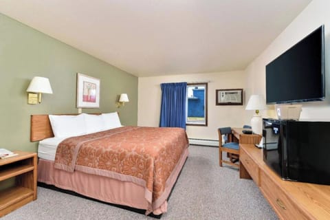 Unwind in a spacious room with TV and desk.