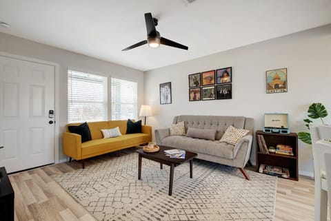Living room with vintage record player, vinyl records, and games