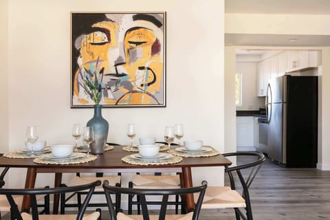 "Gather around our elegant dining table."
