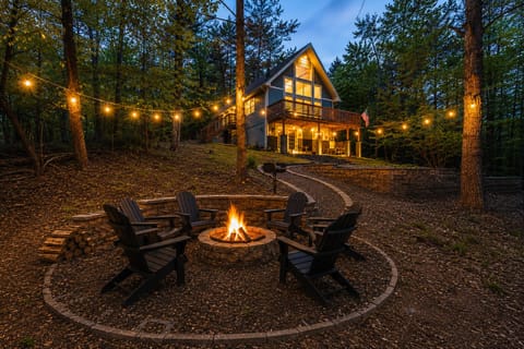 Escape to Longstreet Chalet and relax by the fire pit and hot tub
